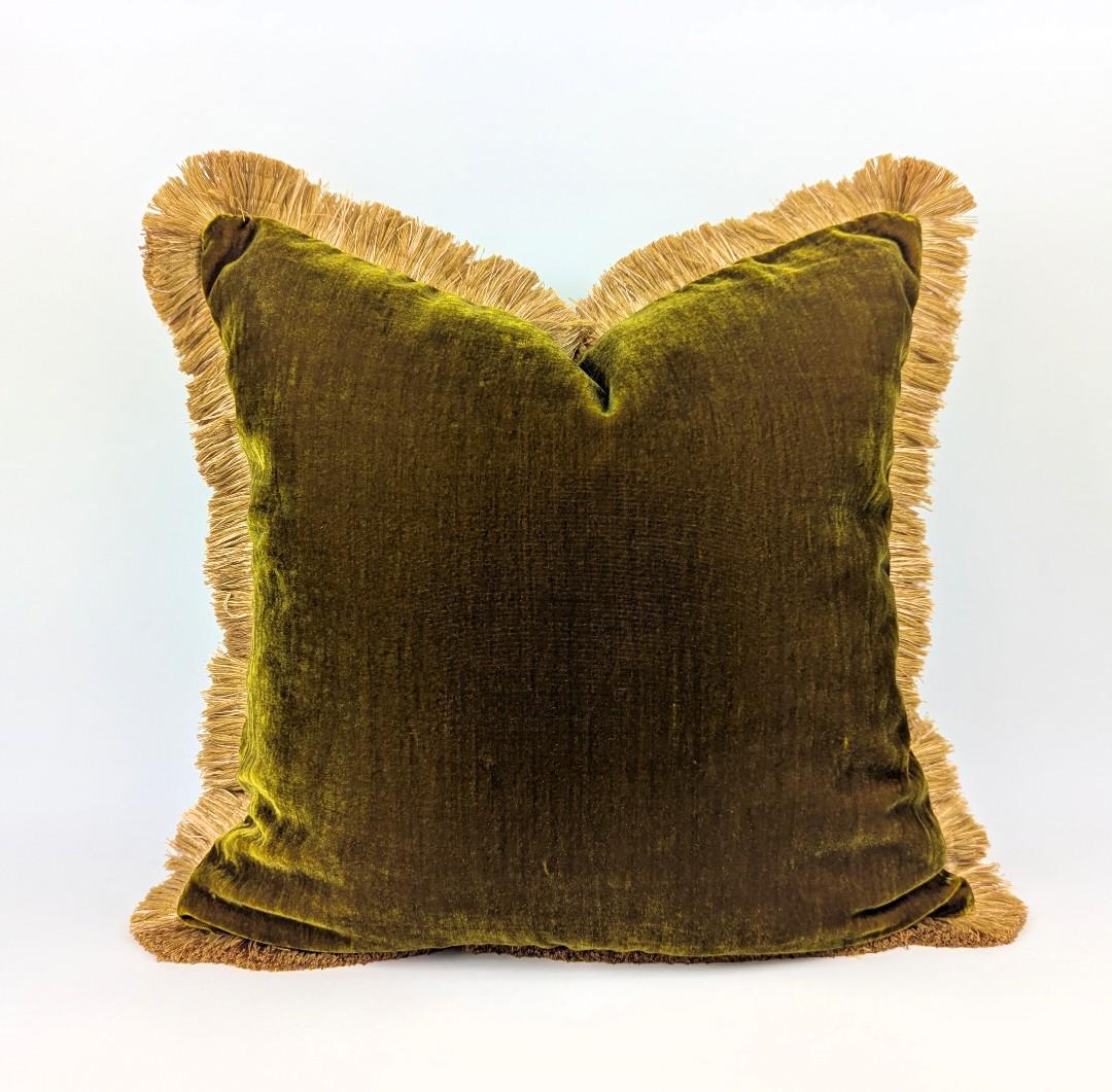 Chartreuse green silk velvet pillow with gold silky fringe trim.
