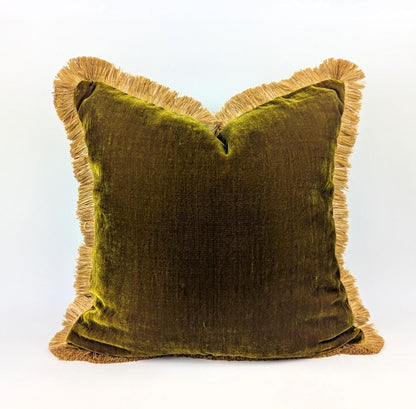 Chartreuse green silk velvet pillow with gold silky fringe trim.