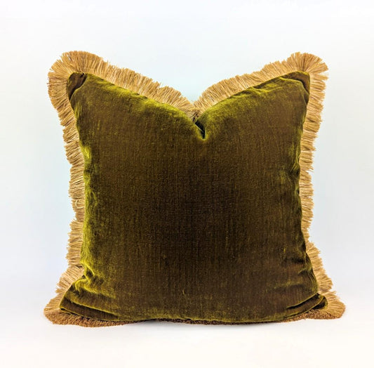 Chartreuse green silk velvet pillow with gold silky fringe trim.